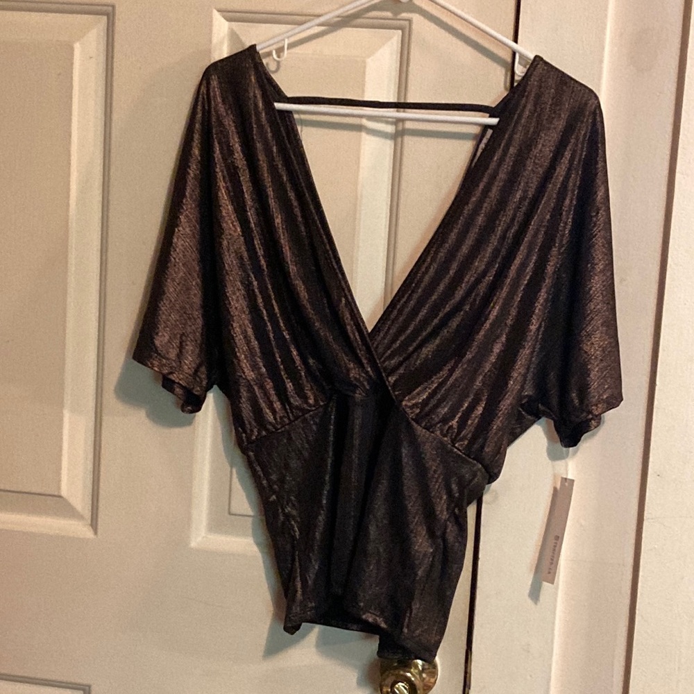 Tempted. LA low dip sheen blouse size L